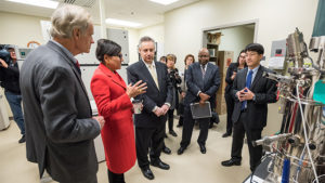 Penny Pritzker talking with group of people
