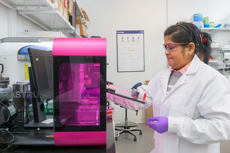 University of Delaware post-doctoral researcher Lina Pradham loads a protocol and plate into a bioprinter made by Inventia. Called the RASTRUM, the Inventia bioprinter prints synthetic matrices loaded with cells of interest into multi-well plates for 3D cultures that allow researchers to study mechanisms and screening of therapeutics.